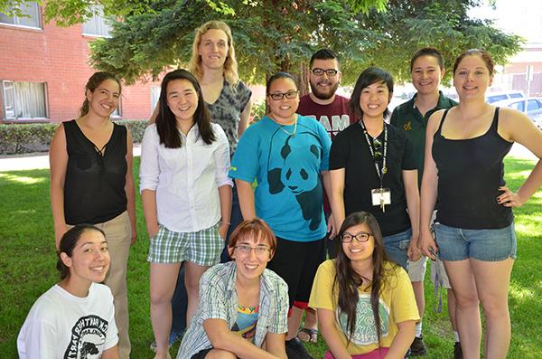 Photo of a group of Peers in Pride students standing outside.